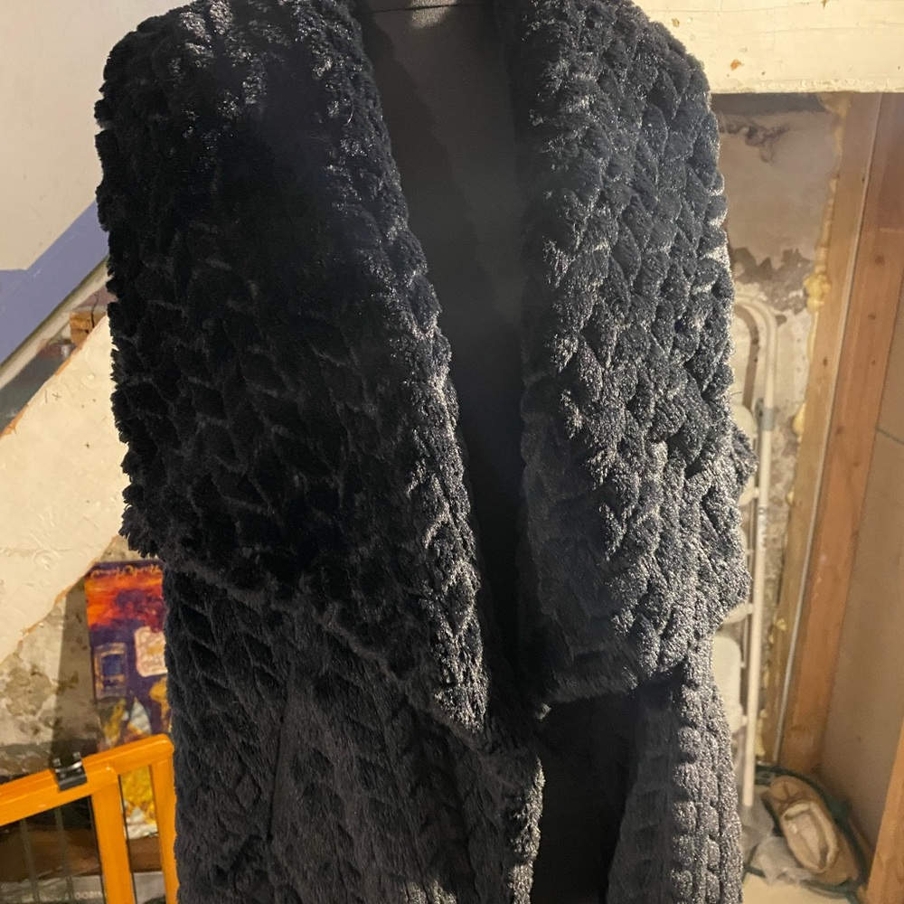 A black Faux vest. Very nice for any outings